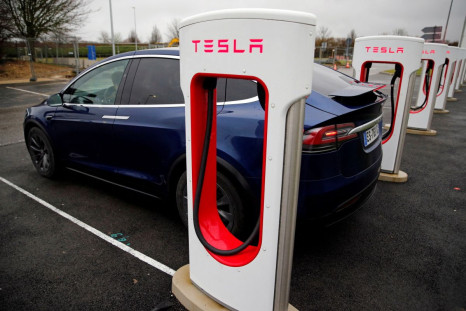 A driver recharges the battery of his Tesla car at a Tesla Super Charging station in a petrol station on the highway in Sailly-Flibeaucourt, France,  January 12, 2019. 