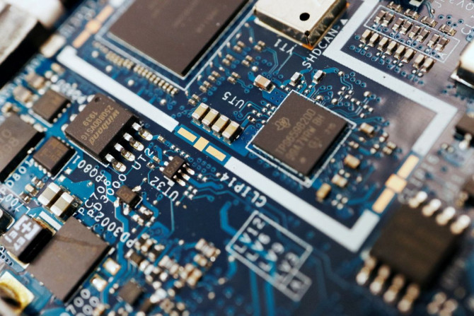FILE PHOTO:Semiconductor chips are seen on a circuit board of a computer in this illustration picture taken February 25, 2022. 