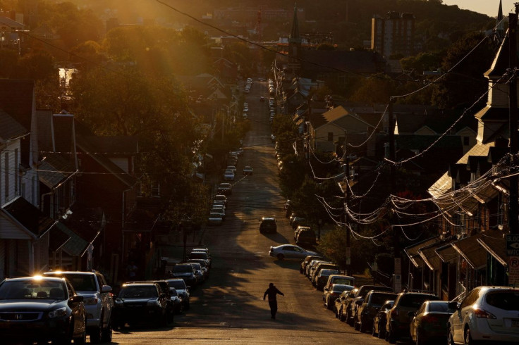 A pedestrian crosses a street in the Northampton County city of Bethlehem, Pennsylvania, U.S., October 1, 2020.  