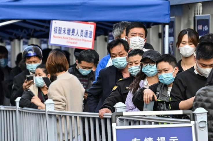 People queue for Covid-19 tests in Shanghai as dozens of cases emerged in the eastern economic hub in recent days
