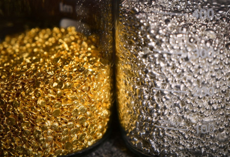 Granules of gold and silver are seen in glass jars at the Krastsvetmet non-ferrous metals plant in the Siberian city of Krasnoyarsk, Russia March 10, 2022. 