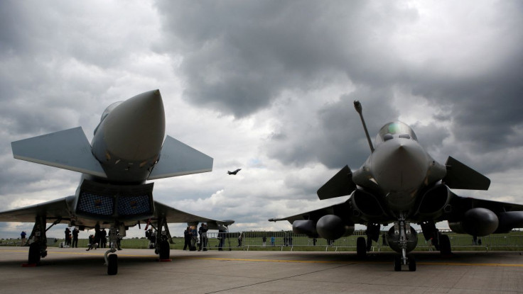 Eurofighter Typhoon (L) and a Dassault Rafale are seen at the ILA Air Show in Berlin, Germany, April 26, 2018.