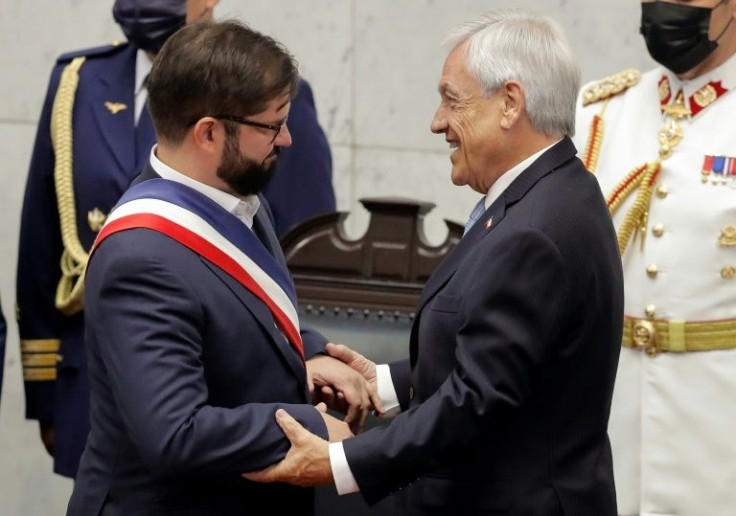 Gabriel Boric (L) is Chile's youngest-ever president