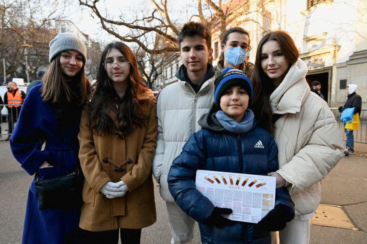 Hassan Alkhalaf, 11, who has escaped from Ukraine to Slovakia on his own, poses with his family members and his brother's girlfriend on the day of an anti-war rally, following Russia's invasion of Ukraine, in Bratislava, Slovakia, March 11, 2022. 