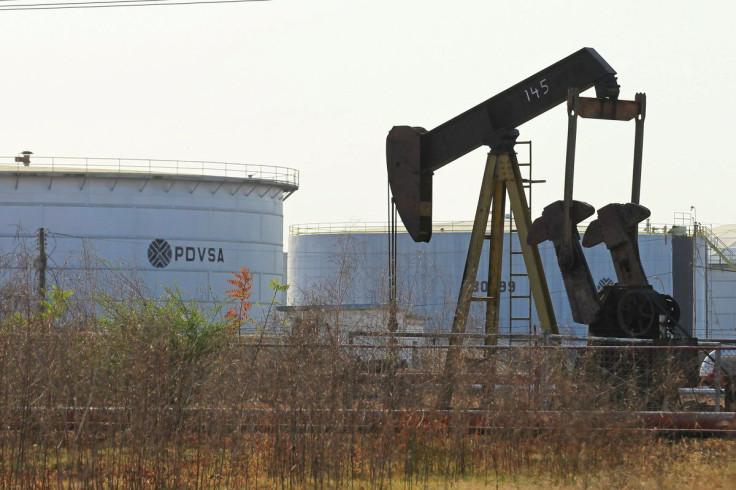 An oil pumpjack and a tank with the corporate logo of state oil company PDVSA are seen in an oil facility in Lagunillas, Venezuela January 29, 2019.
