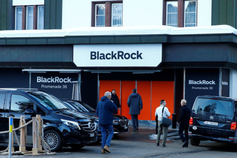 People are seen in front of a showroom that hosts BlackRock in Davos, Switzerland Januar 22, 2020.  