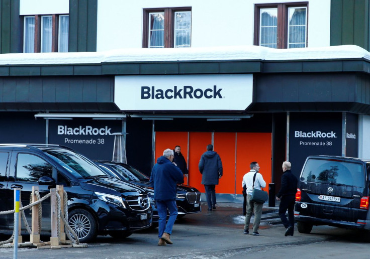 People are seen in front of a showroom that hosts BlackRock in Davos, Switzerland Januar 22, 2020.  