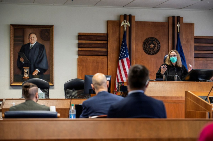 Judge Amy Clark Meachum addresses the court as a court hearing is held on Texas Governor Greg Abbott's order that parents of transgender children be investigated for child abuse, in Austin, Texas, U.S. March 11, 2022.  