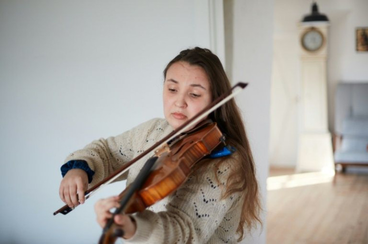 Nadia Safina, 24, had to wait for hours to get on a train in Lviv and fiance Misha had to stay behind
