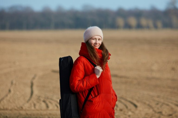 Kseniia Kucherova, 24, and her friends say a walk on the beach at least provides some solace