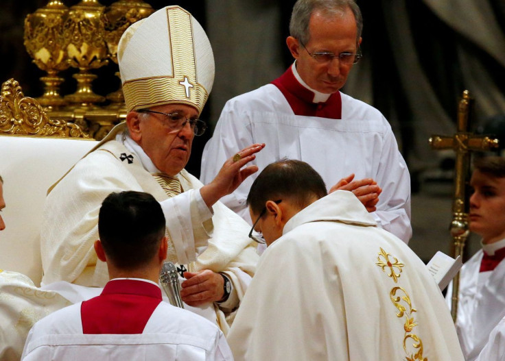 Pope Francis blesses Mons. Waldemar Stanislaw Sommertag during the Episcopal Ordination at Saint Peter's Basilica at the Vatican March 19, 2018.