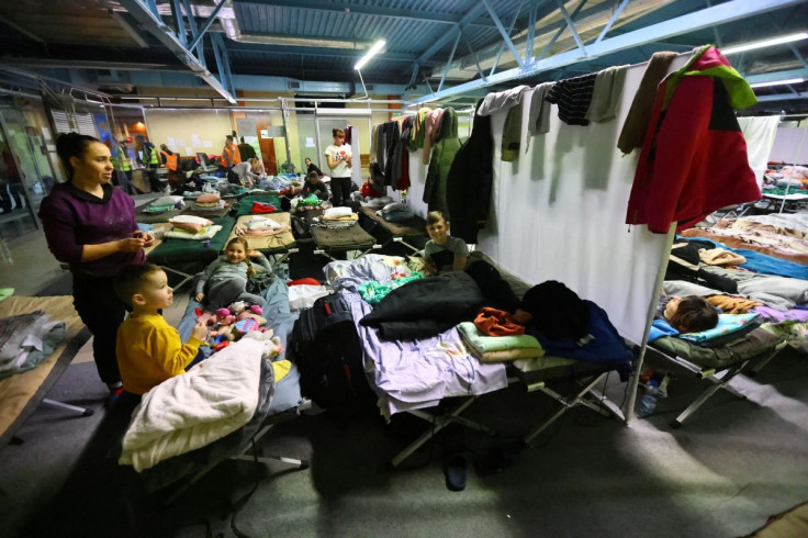 People rest in a temporary accommodation for people fleeing the Russian invasion of Ukraine, in Rzeszow, Poland, March 12, 2022.