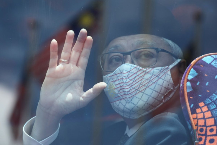 Former Malaysian Deputy Prime Minister Ismail Sabri Yaakob waves to members of the media before departing for a meeting with the King, in Kuala Lumpur, Malaysia, August 19, 2021.