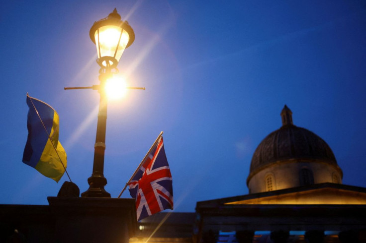 The flags of Ukraine and Britain are seen attached to a lamp post during a demonstration in support of Ukraine, amid the Russian invasion of Ukraine, at Trafalgar Square in London, Britain, March 9, 2022. 