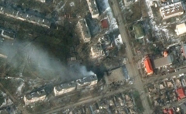 Burning apartment buildings are seen in western Mariupol, Ukraine, in a Maxar satellite image taken and released on March 12, 2022