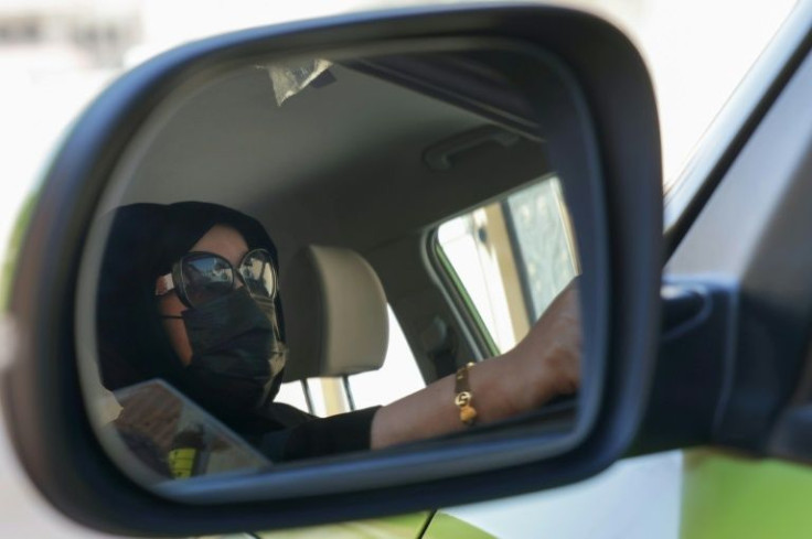 Fahda Fahd picks up fares in the Saudi capital Riyadh from a ride-hailing app exclusively for women, as a way of earning extra cash amid rising living costs in the kingdom