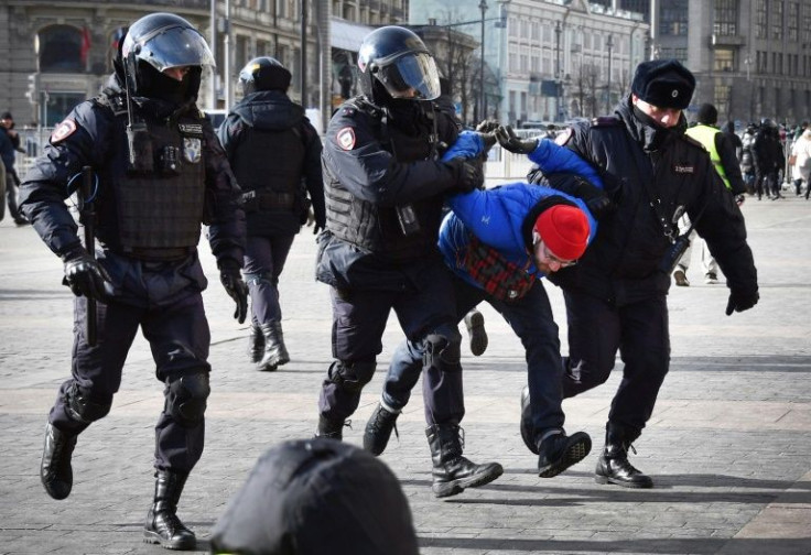 Police detain a protester in central Moscow on sunday