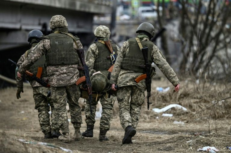 Ukrainian forces are taking casualties in Irpin and could be seen carrying the corpses of their comrades back from the suburb to central Kyiv