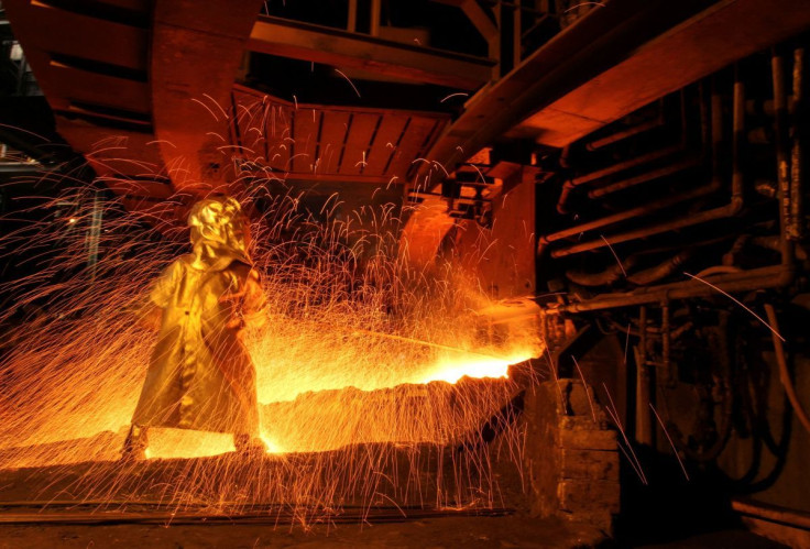 A worker uses the tapping process to separate nickel ore from other elements at a nickel processing plant in Sorowako, South Sulawesi Province, Indonesia March 1, 2012.