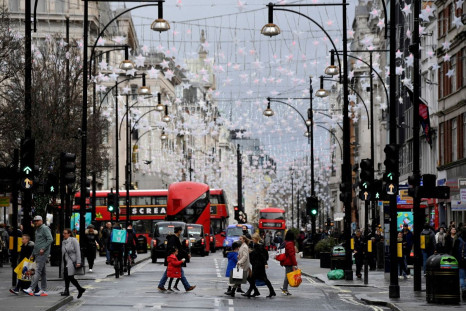 Shoppers cross Oxford Street, London, Britain, December 28, 2021. 