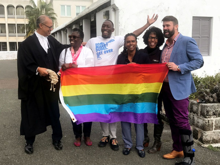Rod Attride-Stirling (L), a lawyer who successfully challenged legislation banning gay marriage, poses for a photograph with gay rights supporters Judith Aidoo-Saltus (2nd L), Winston Godwin (3rd L), Maryellen Jackson (3rd R), Zakiya Johnson Lord (2nd R) 