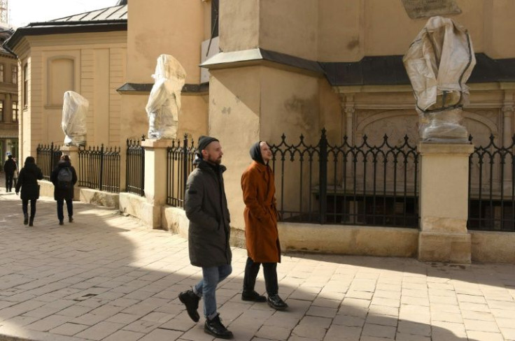 Statues covered with protective wrappings at the Latin Cathedral in Lviv, western Ukraine