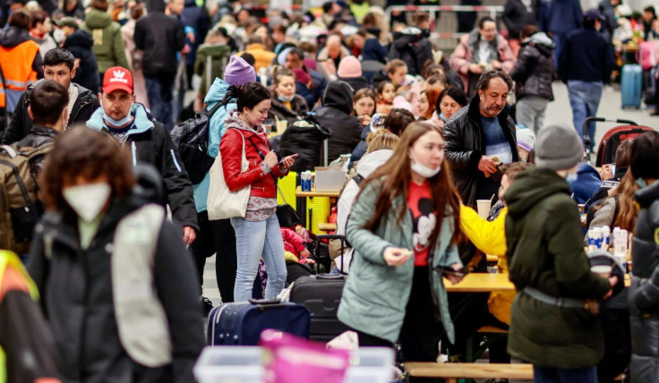 Refugees from Ukraine wait at the central station, amid Russia's invasion of Ukraine, in Berlin, Germany, March 14, 2022.