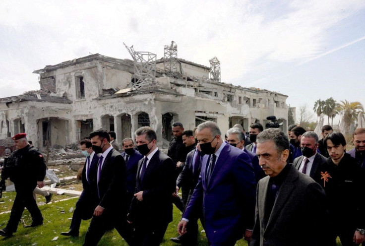 Iraqi Prime Minister Mustafa Al-Kadhimi inspects the site of a damaged building a day after a missile attack, in Erbil, Iraq, March 14, 2022. Iraqi Prime Minister Media Office/Handout via REUTERS