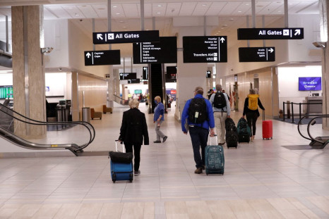 Airline passengers walk inside the Tampa International Airport as airports around the country are awaiting for Verizon and AT&T to rollout their 5G technology, in Tampa, Florida, U.S., January 19, 2022. 