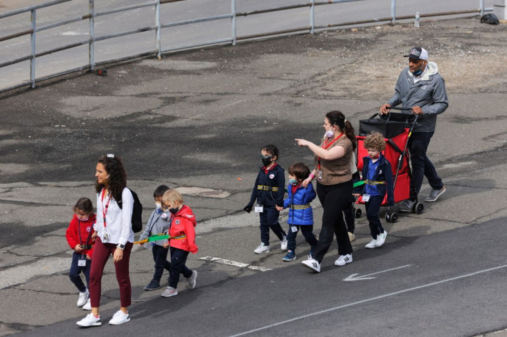 Children are seen walking, on the first day of lifting the indoor mask mandate for DOE schools between K through 12, in Manhattan, New York City, New York, U.S., March 7, 2022.