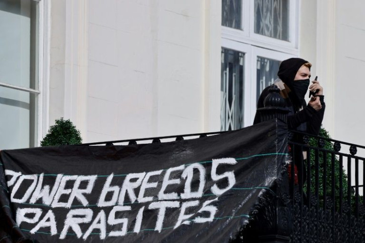 Banners were unfurled from the property at 5 Belgrave Square, including one stating 'This property has been liberated'