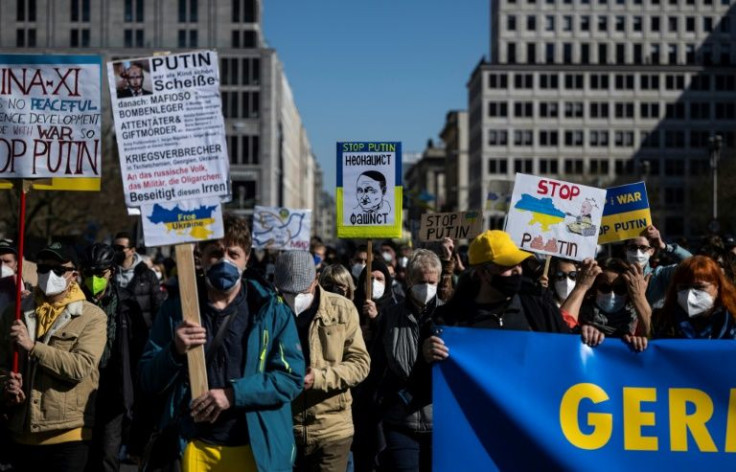 Posters depicting Putin with a Hitler moustache are often seen at Ukraine solidarity marches