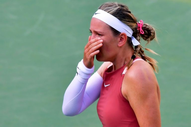 Victoria Azarenka of Belarus cries between points before defeat to Elena Rybakina of Kazakhstan