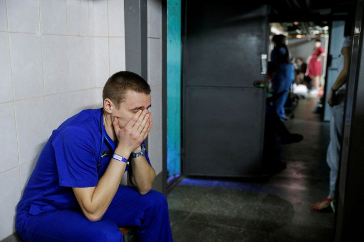 A doctor takes shelter in the basement of a perinatal centre as air raid siren sounds are heard in Kyiv, Ukraine, March 2, 2022.
