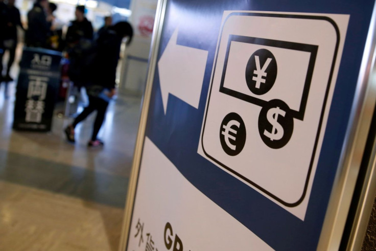 Currency signs of Japanese Yen, Euro and the U.S. dollar are seen on a board outside a currency exchange office at Narita International airport, near Tokyo, Japan, March 25, 2016.  