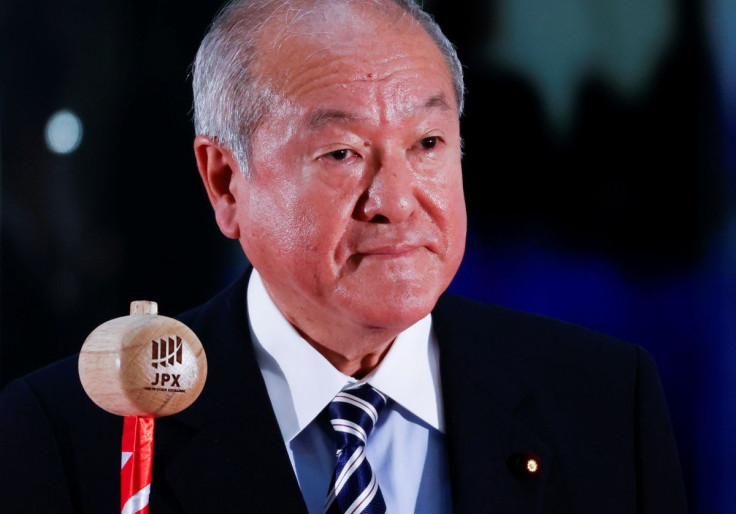 Japan's Finance Minister Shunichi Suzuki prepares to ring a bell during the New Year ceremony marking the open of trading in 2022 at the Tokyo Stock Exchange (TSE), amid the coronavirus disease (COVID-19) pandemic, in Tokyo, Japan, January 4, 2022. 