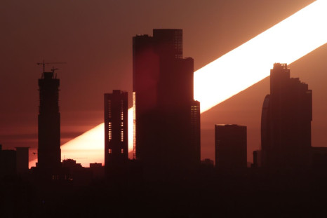 The sun rises behind the skyscrapers of the Moscow International Business Centre, also known as "Moskva-City", in Moscow, Russia April 23, 2018. Picture taken with long exposure. 