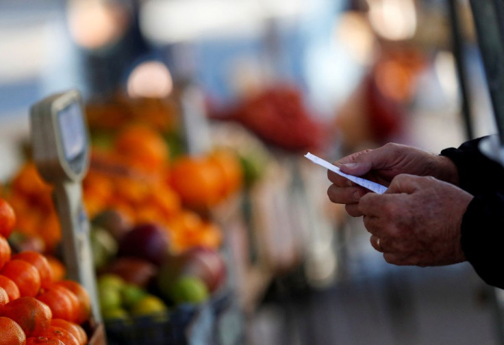 A customer holds a shop list at a greengrocery store in a street market, in Buenos Aires, Argentina June 15, 2021. 