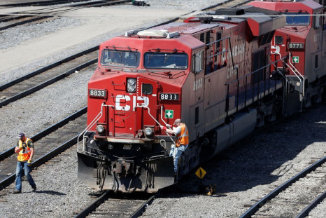 A Canadian Pacific Railway crew works on their train at the CP Rail yards in Calgary, Alberta, April 29, 2014. 