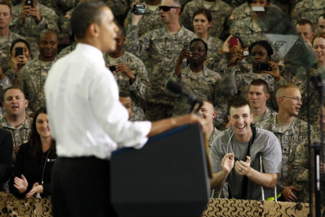 A soldier wounded in Afghanistan applauds as U.S. President Barack Obama speaks to troops at Fort Campbell in Kentucky May 6, 2011. Obama addressed several military units that have recently returned from duty in Afghanistan.