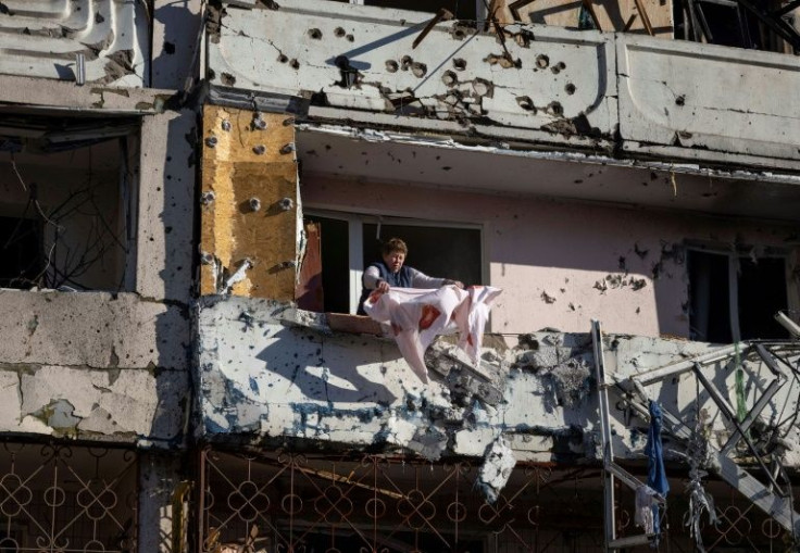 Kyiv was shaken by four blasts early on Tuesday, hitting residential buildings and a metro station, killing two people