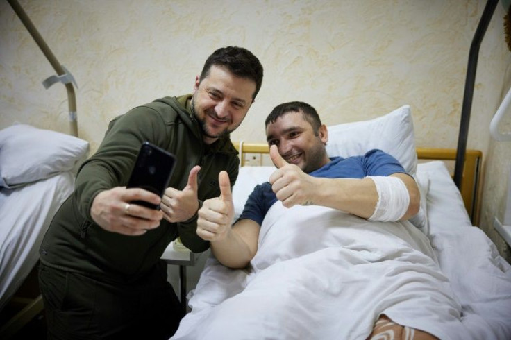 Ukrainian President Volodymyr Zelensky (L) has been portrayed as a superhero