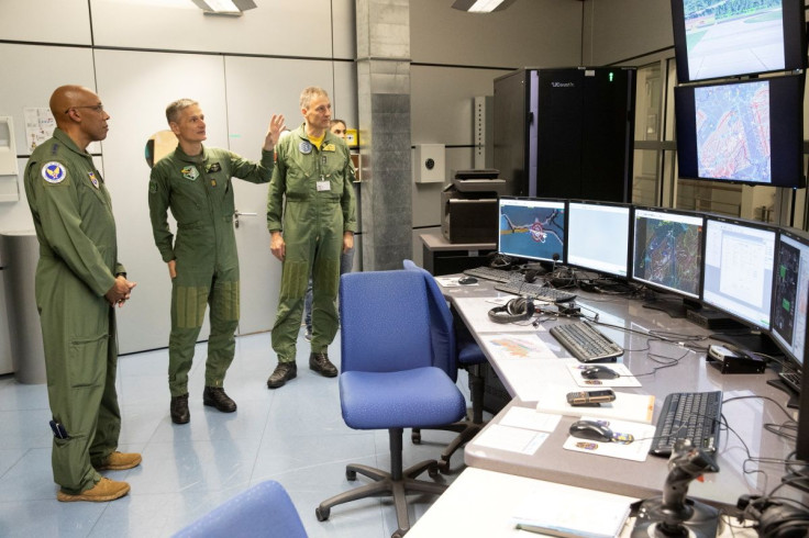 Commander of the Swiss Air Force General Peter Merz and Chief of Staff of the U.S. Air Force General Charles Q. Brown Jr. visit a control room of a flight simulator at a Swiss airbase in Payerne, Switzerland March 15, 2022.