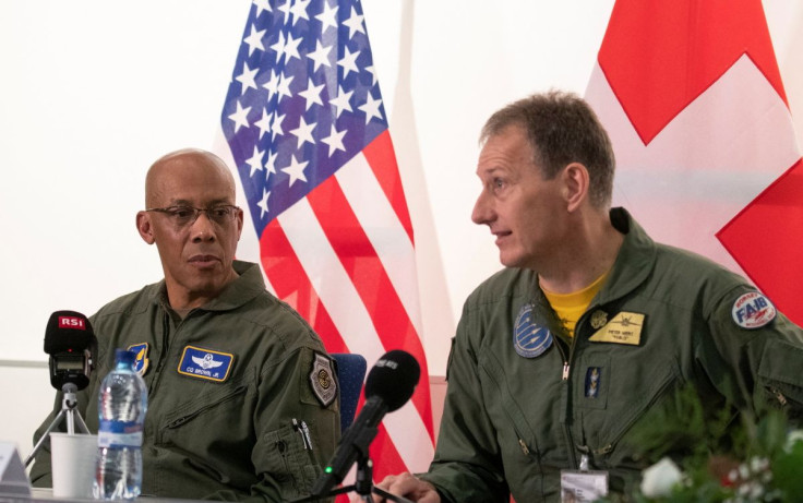 Chief of Staff of the U.S. Air Force General Charles Q. Brown Jr. listens to Commander of the Swiss Air Force General Peter Merz during a news conference at a Swiss airbase in Payerne, Switzerland March 15, 2022.  