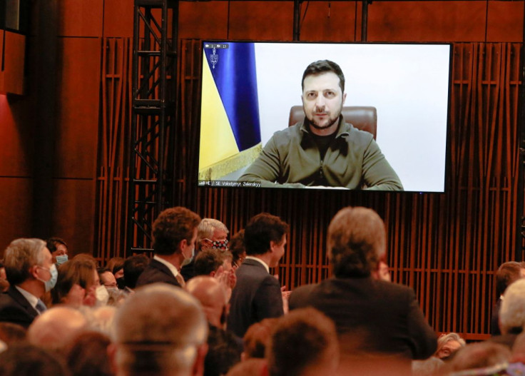 Members of the House of Commons and Senate listen as Ukrainian President Volodymyr Zelenskiy, who appears on a screen, addresses the Canadian parliament in Ottawa, Ontario, Canada, March 15, 2022.