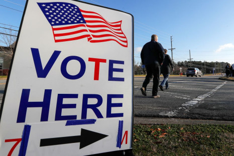 A sign is seen as voters line up for the U.S. Senate run-off election, at a polling location in Marietta, Georgia, U.S., January 5, 2021. 