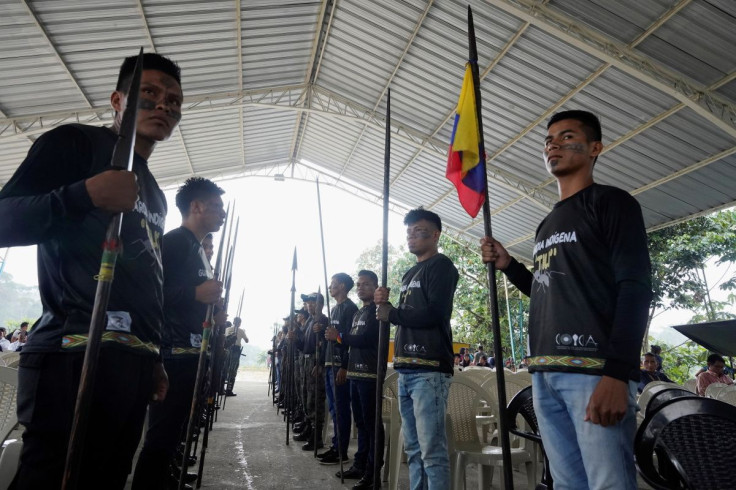 Men stand with spears during a meeting where leaders from indigenous communities in the Amazon basin demanded South American governments halt extractive industries that damage the rainforest, in Union Base, Ecuador March 15, 2022.