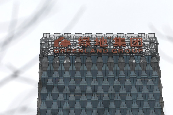 A sign of Greenland Holdings Corp. Ltd. is seen on its building in Beijing, China March 11, 2022. 