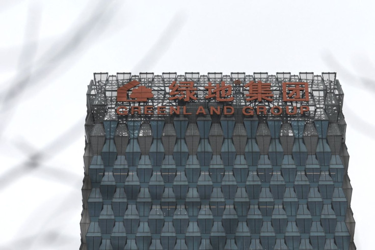 A sign of Greenland Holdings Corp. Ltd. is seen on its building in Beijing, China March 11, 2022.