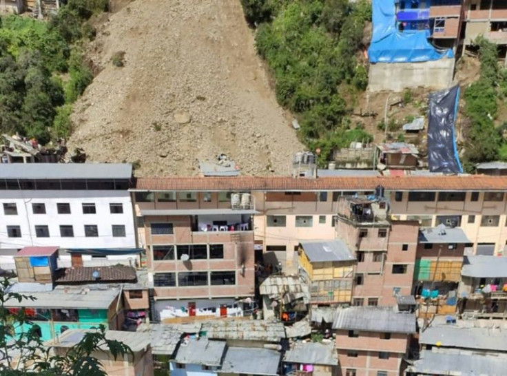 The landslide in Retamas buried dozens of houses and trapped at least 15 people, with the number of missing expected to rise